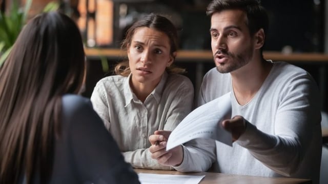 Annoyed,Angry,Disappointed,Customers,Clients,Couple,Holding,Paper,Arguing,With