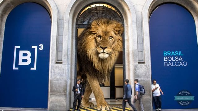 Montagem mostra leão gigante saindo pela porta da B3/Ibovespa, reprentando a Receita Federal e o Imposto de Renda