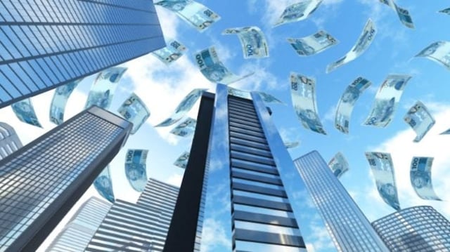 Notas de dinheiro caindo sobre prédios - fundos imobiliários fiis dividendos fundos imobiliários MXRF11