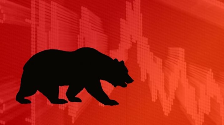 Ilustração com a sombra de um urso projetada sobre um fundo vermelho e um gráfico de linha. Simboliza o bear market e a cautela na bolsa e nos mercados financeiros | Ibovespa