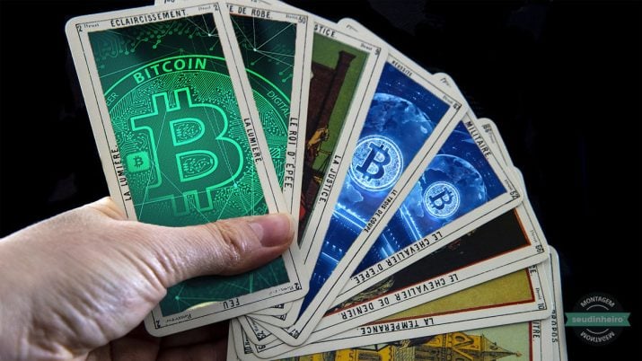 Mão segurando cartas que mostram o futuro do bitcoin