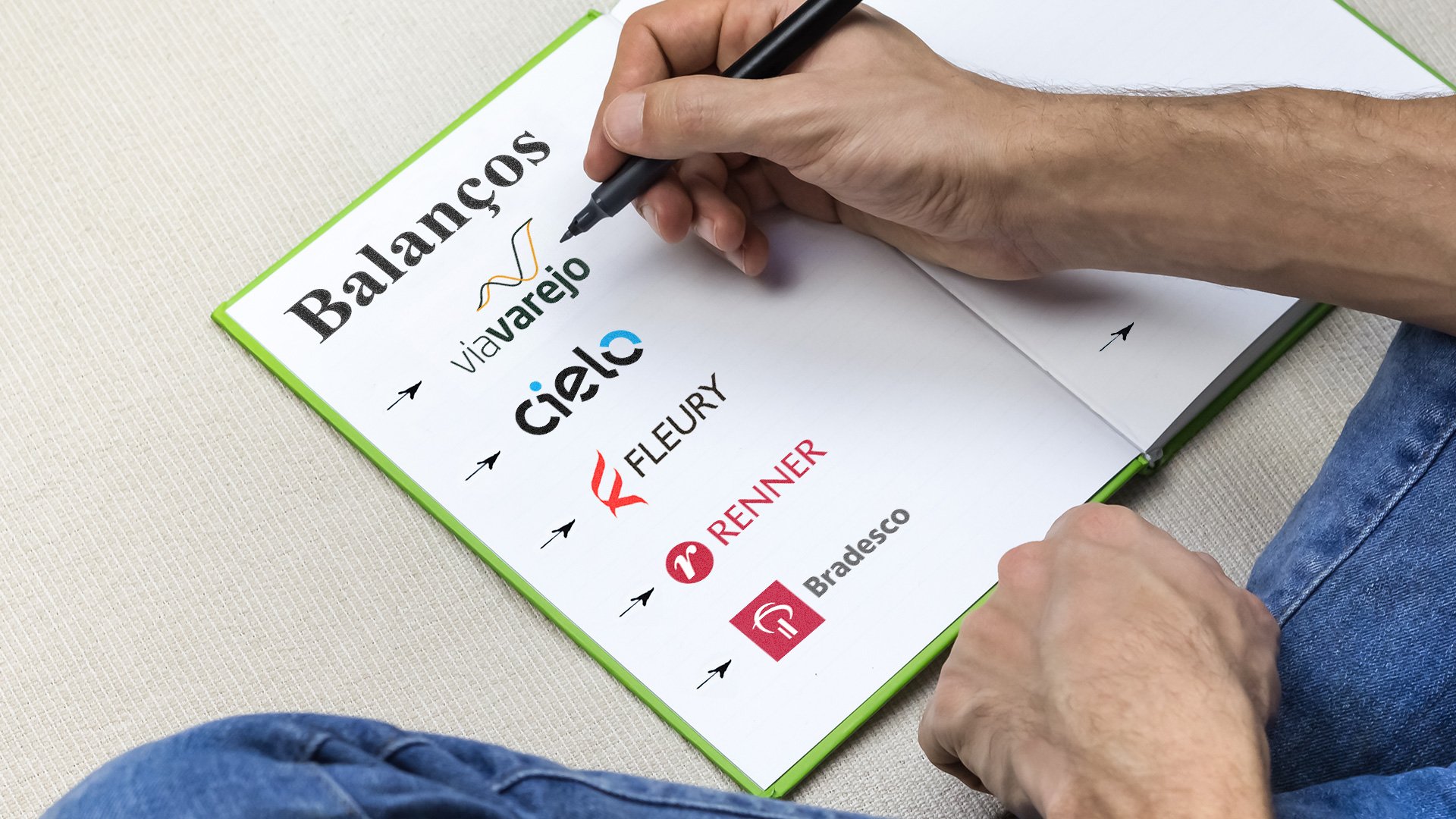 Homem anota nomes de empresas que vão divulgar balanços