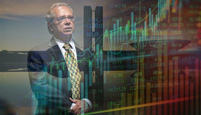 Paulo Guedes em frente ao gráfico do Ibovespa