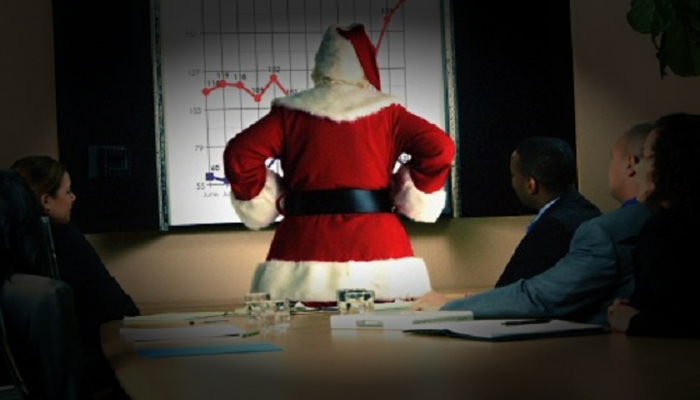 Papai Noel observa gráfico de alta