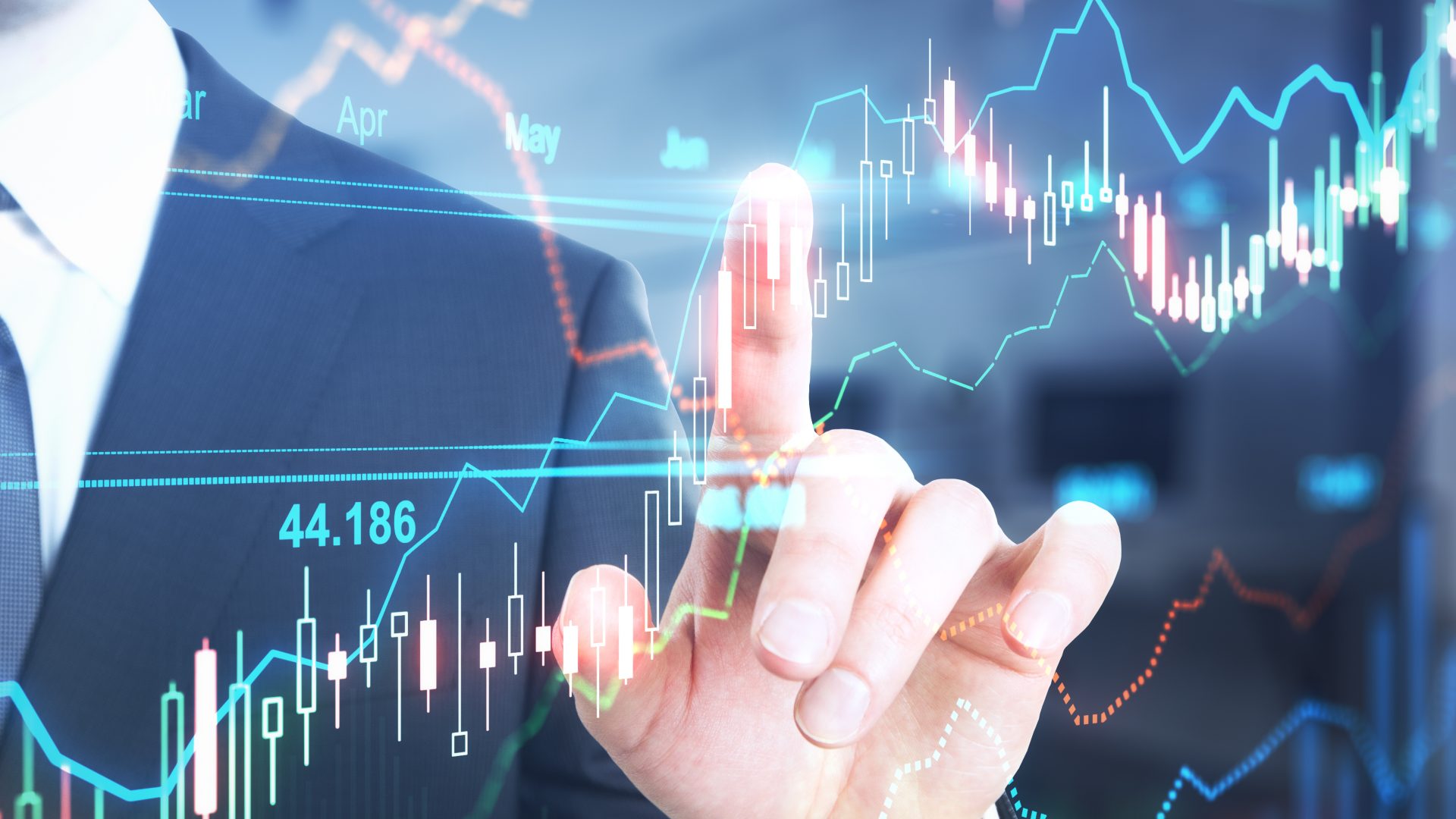 Dedo aponta para gráfico de ações de tecnologia