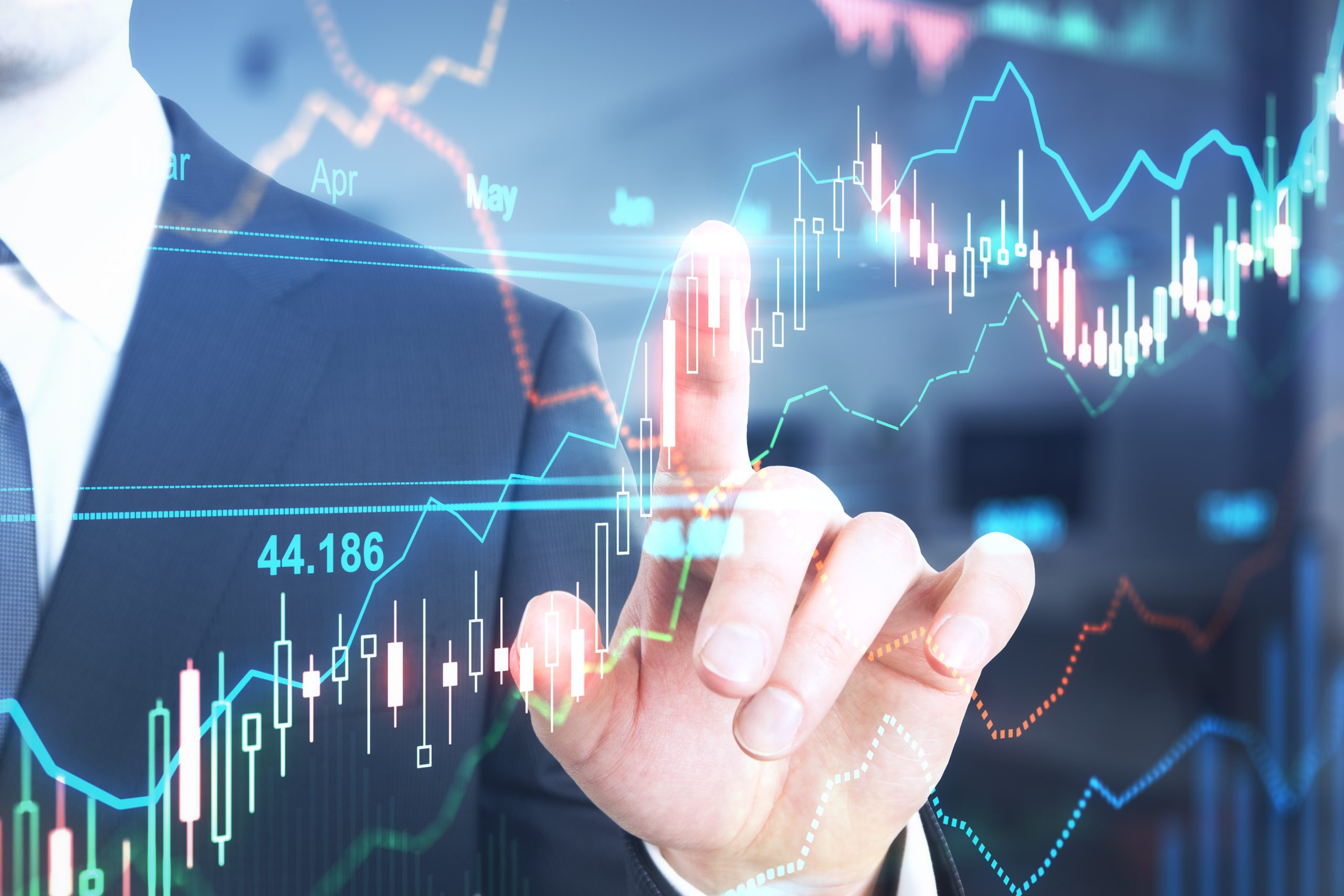 Dedo aponta para gráfico de ações de tecnologia