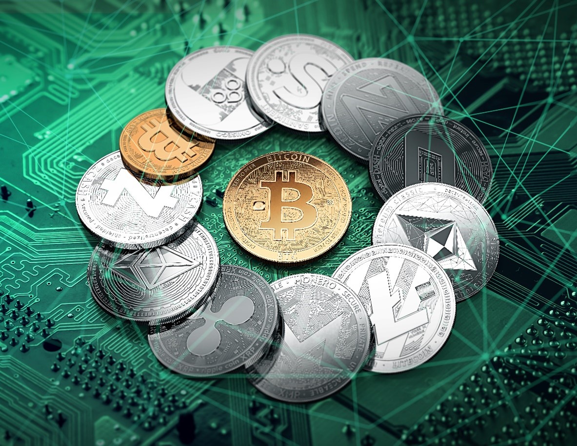 imagem com moedas físicas de cripto